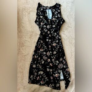 Floral black dress. Light weight and adjust really nice to the body.